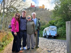 Guest in Sintra in a private tour seeing Pena palace from the outside with a tuk tuk