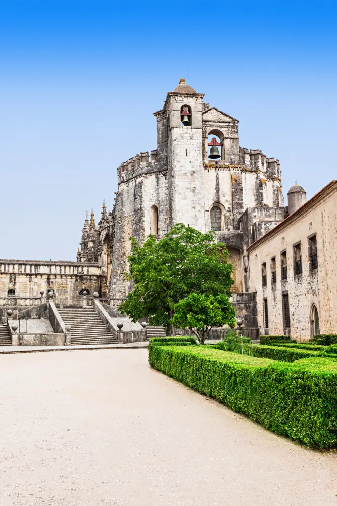 Historic Convent of Christ in Tomar with gardens and stone bell towers