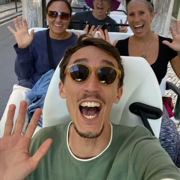 Joyful moment during a Sintra private tuk tuk tour with enthusiastic visitors and a friendly guide exploring Portugal’s hidden gems.