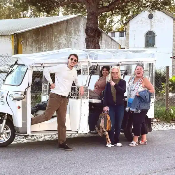 Happy group with guide Daniel Ponce during a private tuk tuk tour in Sintra, Portugal – exploring off-the-beaten-path locations with Yes, You Deserve!