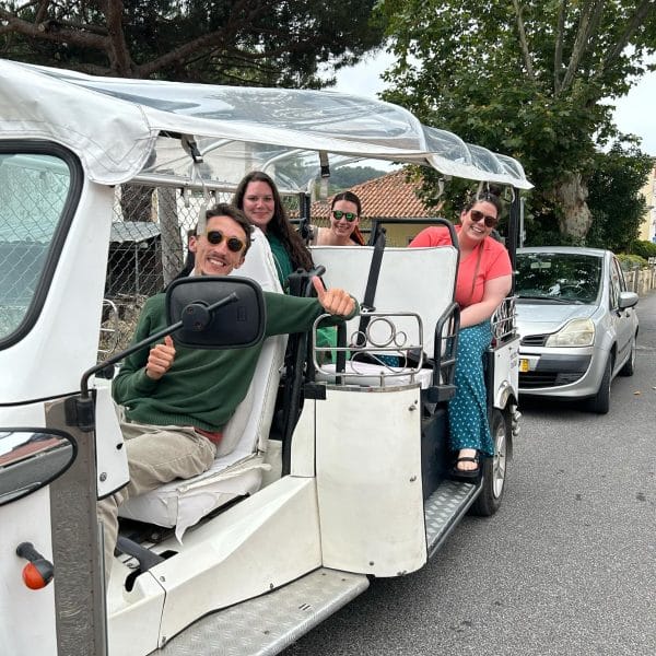Private tuk-tuk tour in Sintra, Portugal with smiling guide Daniel Ponce and three happy visitors enjoying the experience – Yes, You Deserve.